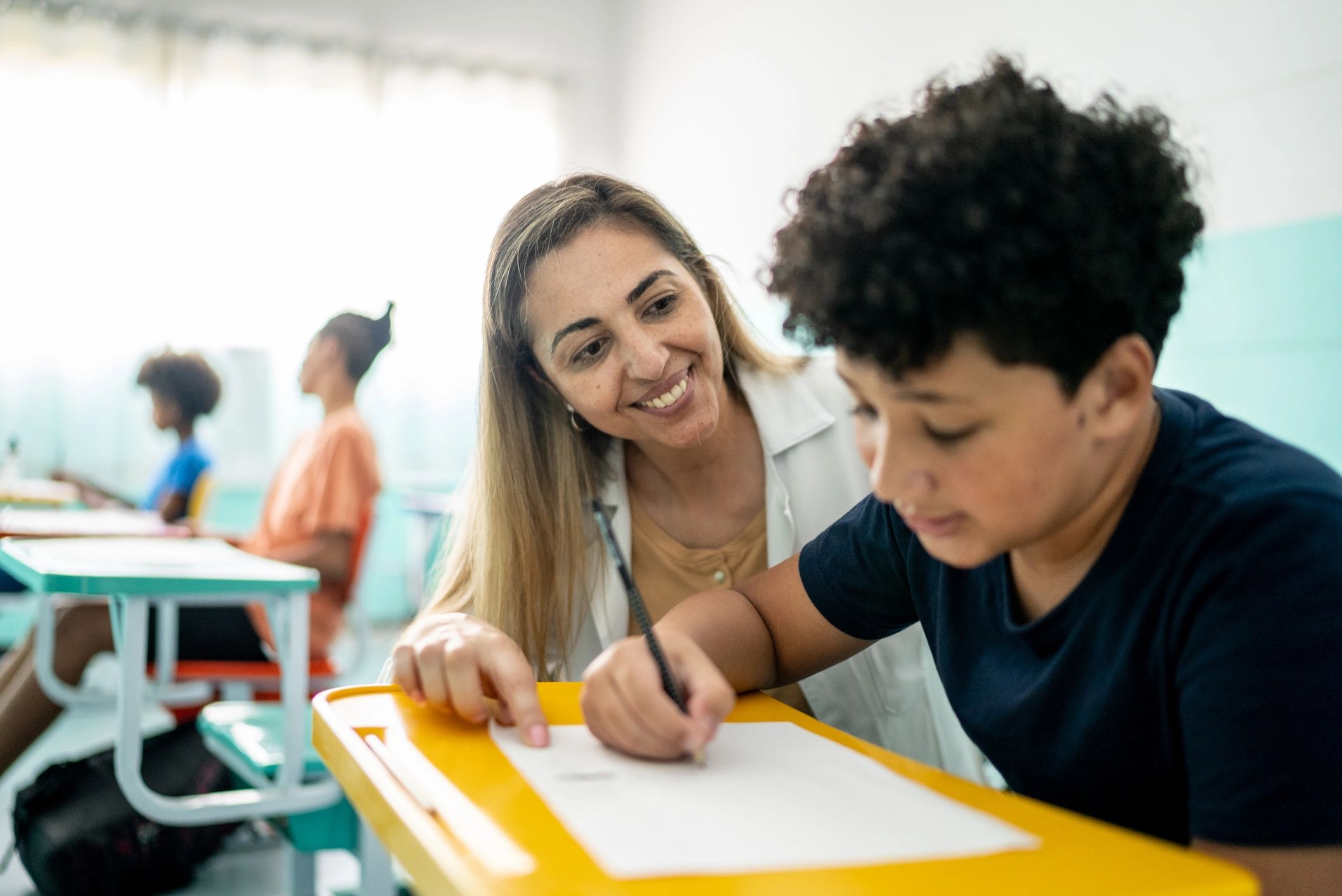 Tutor helping a primary school student