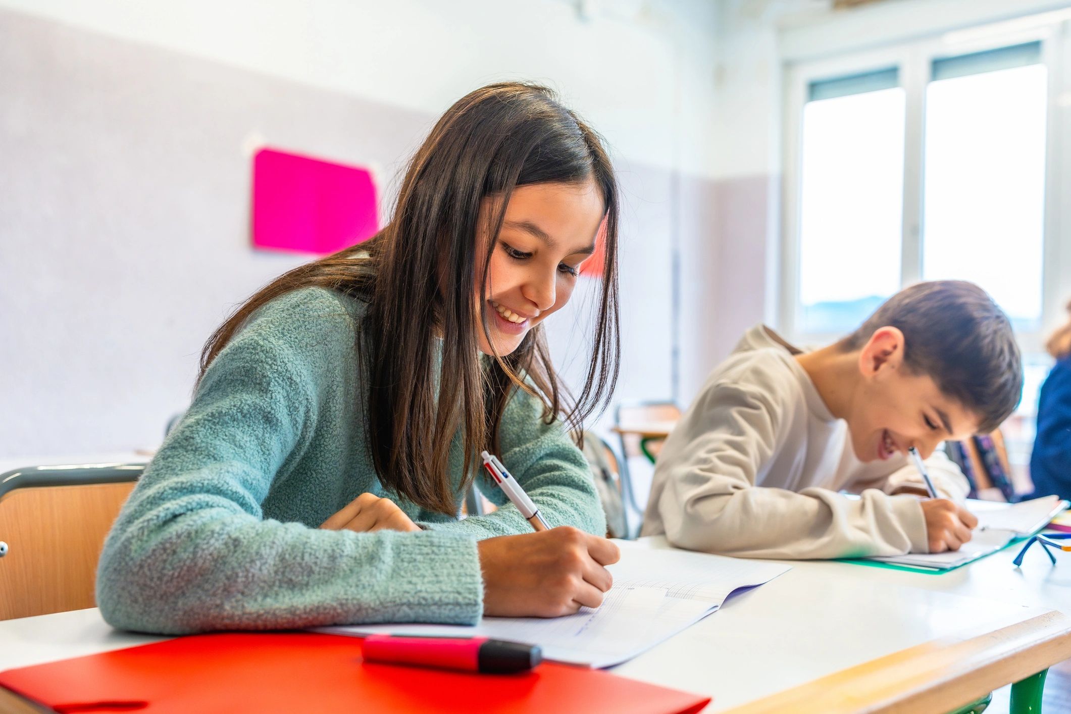 Primary school students learning at their desks