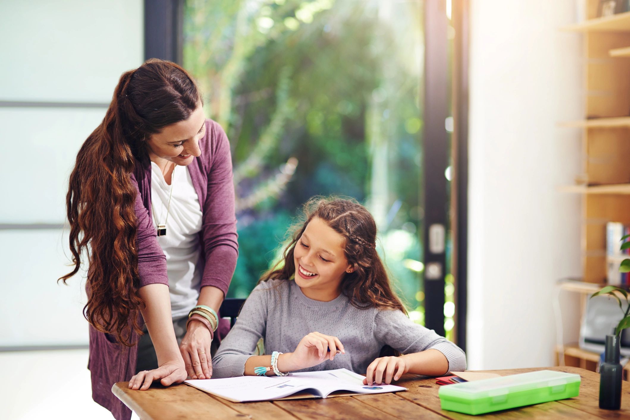 Child doing homework with parent support